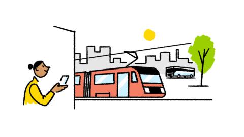 A person is waiting for an approaching red tram, a bus in the background.