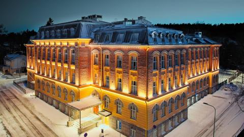 Pyynikki High School in wintertime with evening lighting.