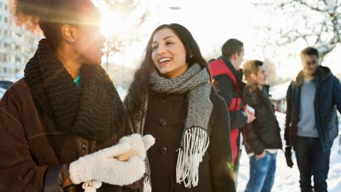 Five people in a winter landscape.