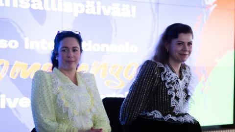 Two Roma women perform at a Roma Day celebration.