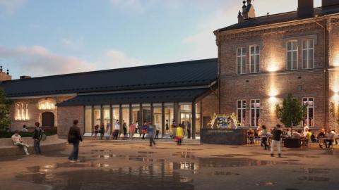 Havainnekuva remontoidusta tiilirakennuksesta, jossa lasikuisti.