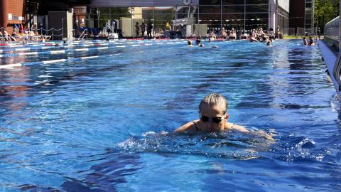 A swimmer in the outdoor pool.