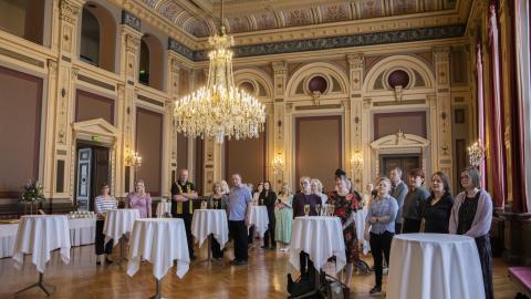 People in the Town Hall listening to the speech.