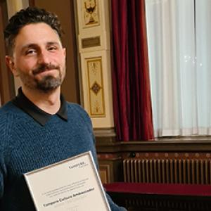 Aram Tertzakian at Tampere Old City Hall with Tampere Culture Ambassador certificate