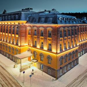 Pyynikki High School in wintertime with evening lighting.