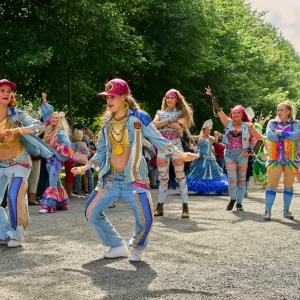 Street dancers in eye-catching outfits in Hämeenpuisto Park.