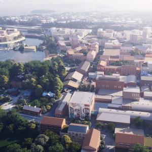 Havainnekuvassa näkyy etualalla Hiedanrannan tehdas sekä suunniteltuja rakennuksia sen ympärillä kauniina kesäpäivänä.