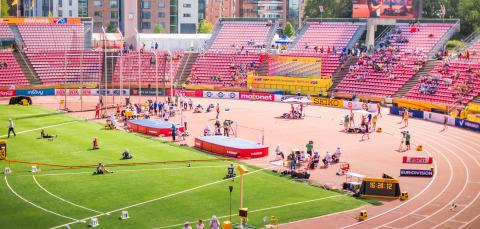 Tampere Stadium and athletes on the field.
