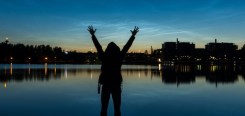 A person raising hands in Tampere