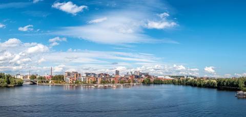 View from Pyhäjärvi towards the centre of the station area. Lake and buildings.
