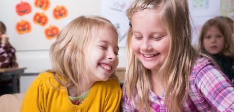 Two happy children at school.