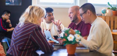 A multicultural group having a conversation.