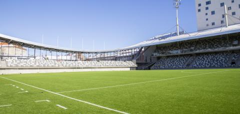 The Tammela stadium, green football field on the front.