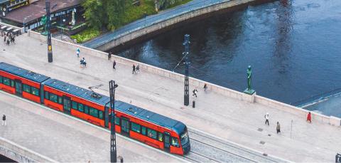Aerial view of a red tram in Hämeenpuisto in summer.