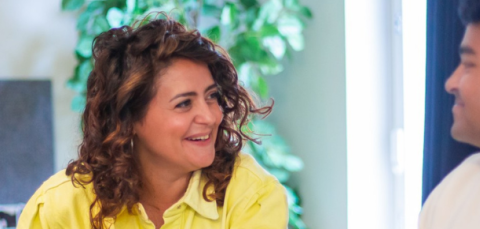 Two people happily talking side by side.