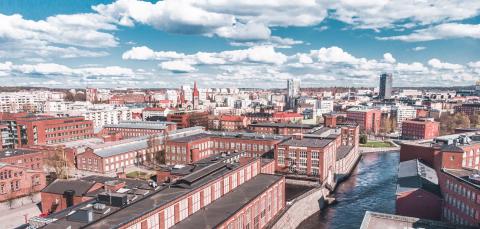 An aerial view of the red-brick factories in downtown Tampere and the Tammerkoski rapids.