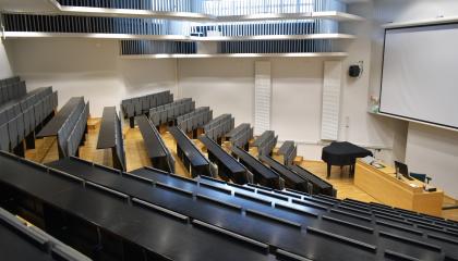 The rows of seats and the screen in Sampola’s auditorium.