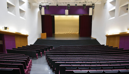 The rows of seats and stage in Sampola’s event hall.
