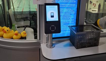 Swimming pool QR code reader and wristbands in the basket.