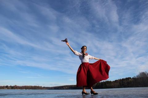 a Person dancing on the ice of lake.