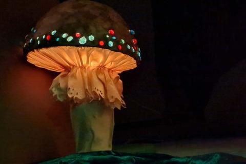 Handmade mushroom with lights on its cap.