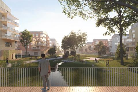 Bridge, houses and green riverside.